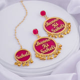 Bride tribe earrings with maang tikka.