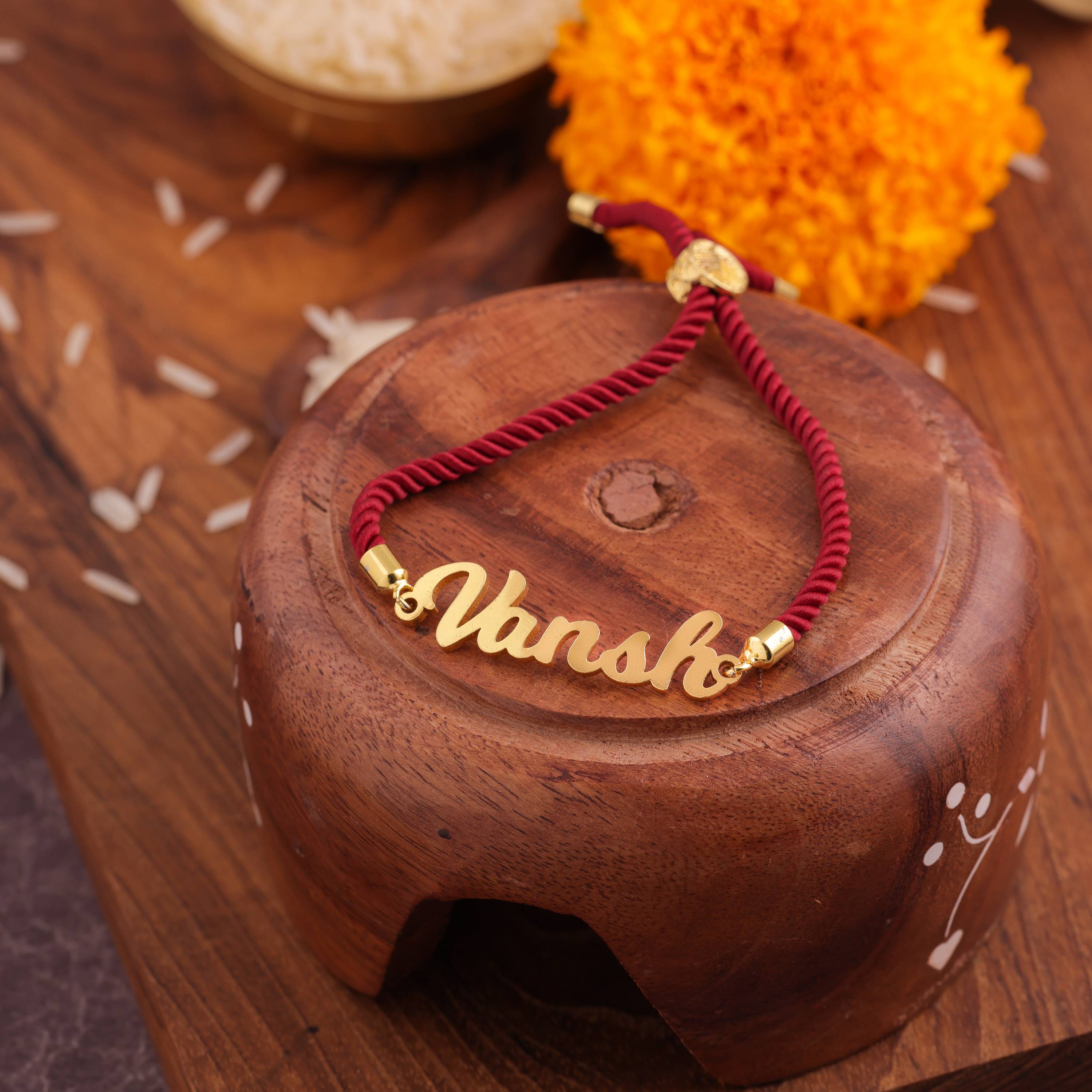 Personalized Rakhi Knotted In Red Thread